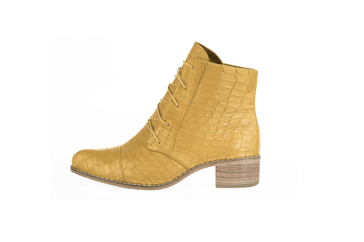 Mustard yellow women's ankle boots with laces at the front. Round toe. Low leather soles. Profile view - Florence KOOIJMAN